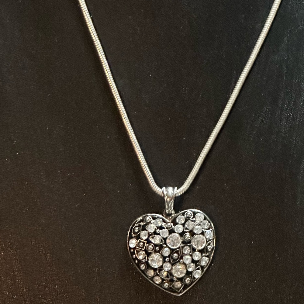 Silver tone heart pendant with light gray, dark gray, and clear rhinestones.